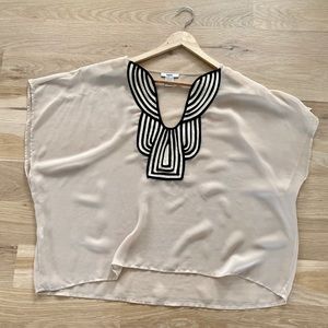 Beautiful beige w/ black neck detail flowy blouse